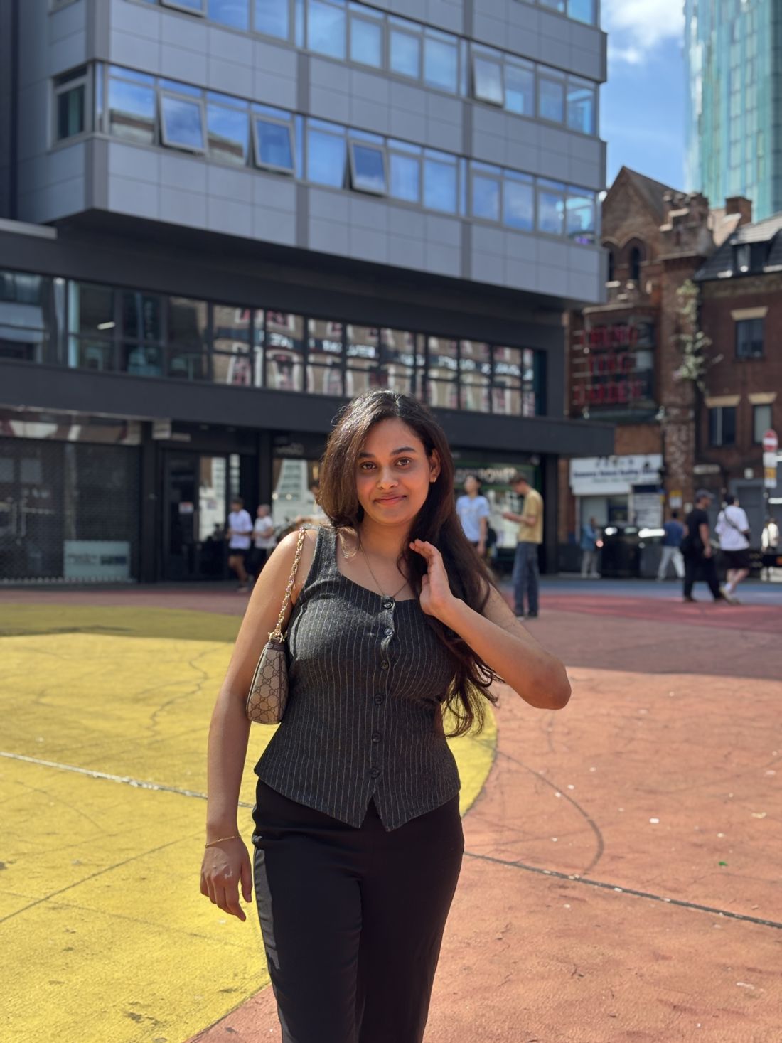 Bindushree smiling on a city street